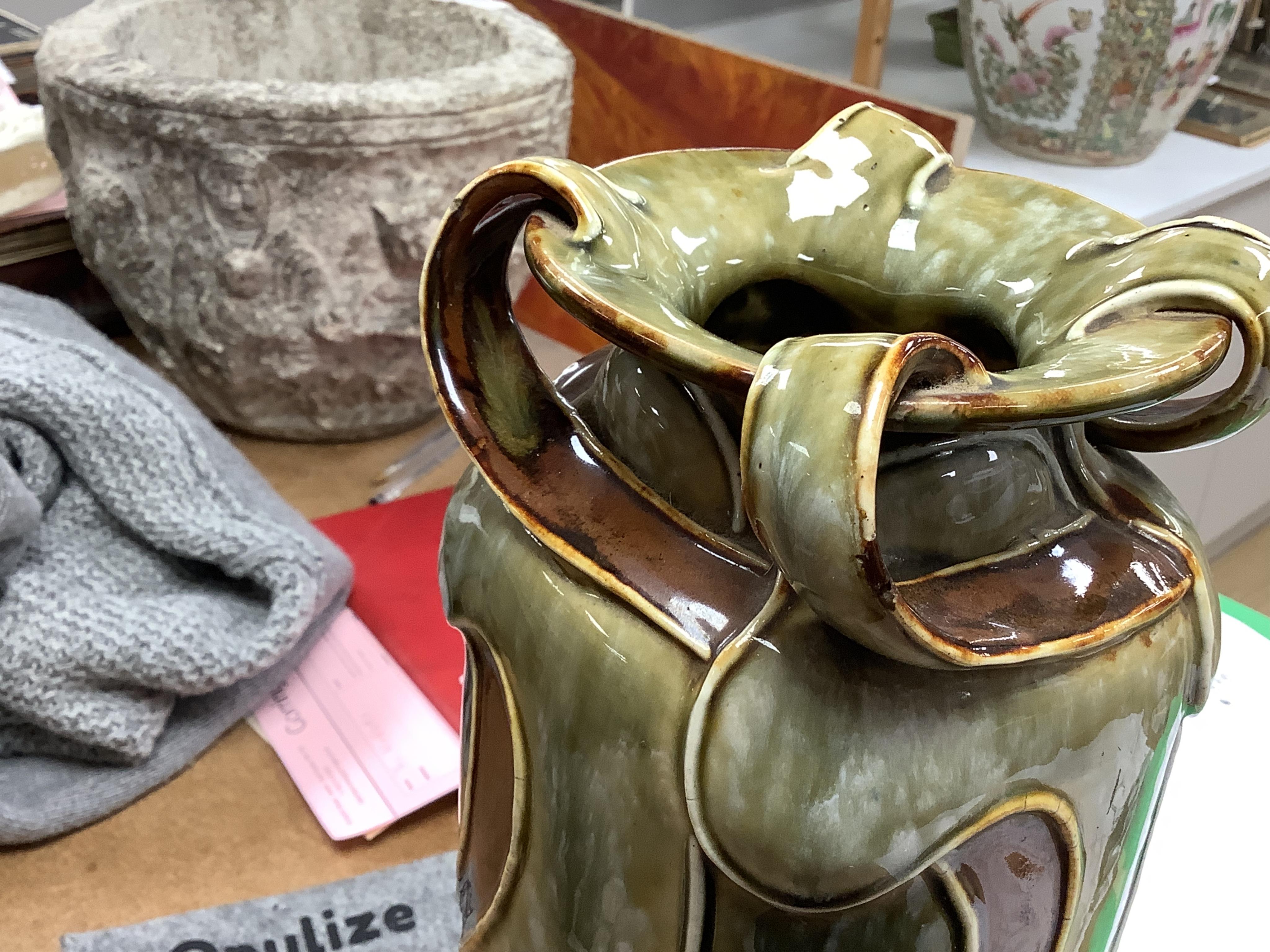 A pair of Royal Doulton, Art Nouveau vases by Frank Butler, incised and impressed marks to the bases, 37cm high